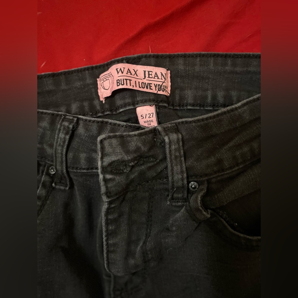 Black ripped black jeans